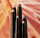 GROUPING OF SHADOW STICKS ON BACKGROUND OF FIREWORKS