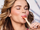 model wearing summer makeup colors and eating sorbet