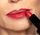 Model applying Plush lipstick