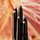 GROUPING OF SHADOW STICKS ON BACKGROUND OF FIREWORKS