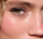 Close-up view of complexion makeup on the face