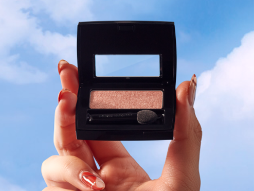 Hand holding eyeshadow Hand holding eyeshadow