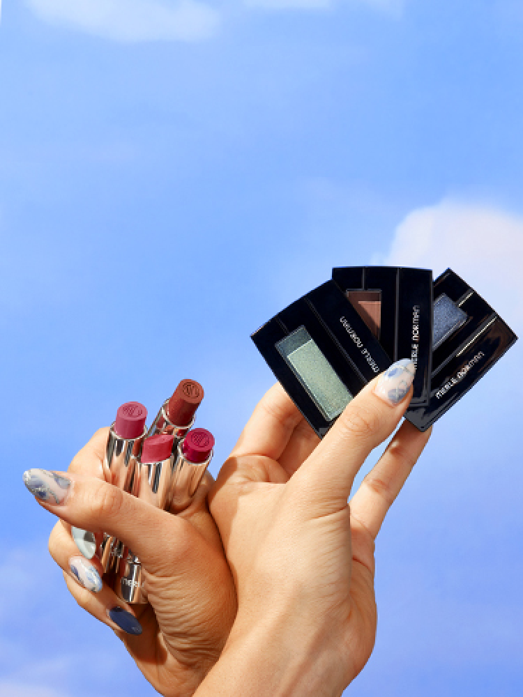 hands holding new spring makeup